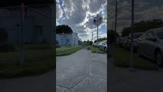 Boy rides Big Wheel down block on sidewalk then does a skid shortstop and flips then lands on head
