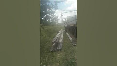 unloading pole from vehicle