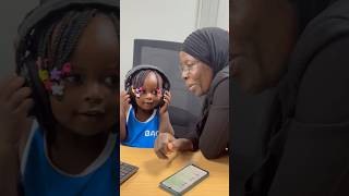 Hajjati teaching Baby Bronia how to use a computer