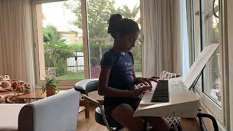 Nine years old (Joanne Benjamin) performing Piano