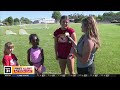 Bella is at St. Francis High School, learning about the summer sports camp!
