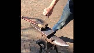 Hammer clipping a horseshoe with a cross pein