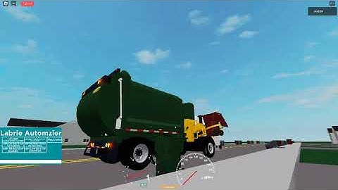 A FREIGHTLINER CONDOR LABRIE AUTOMIZER ON TRASH.