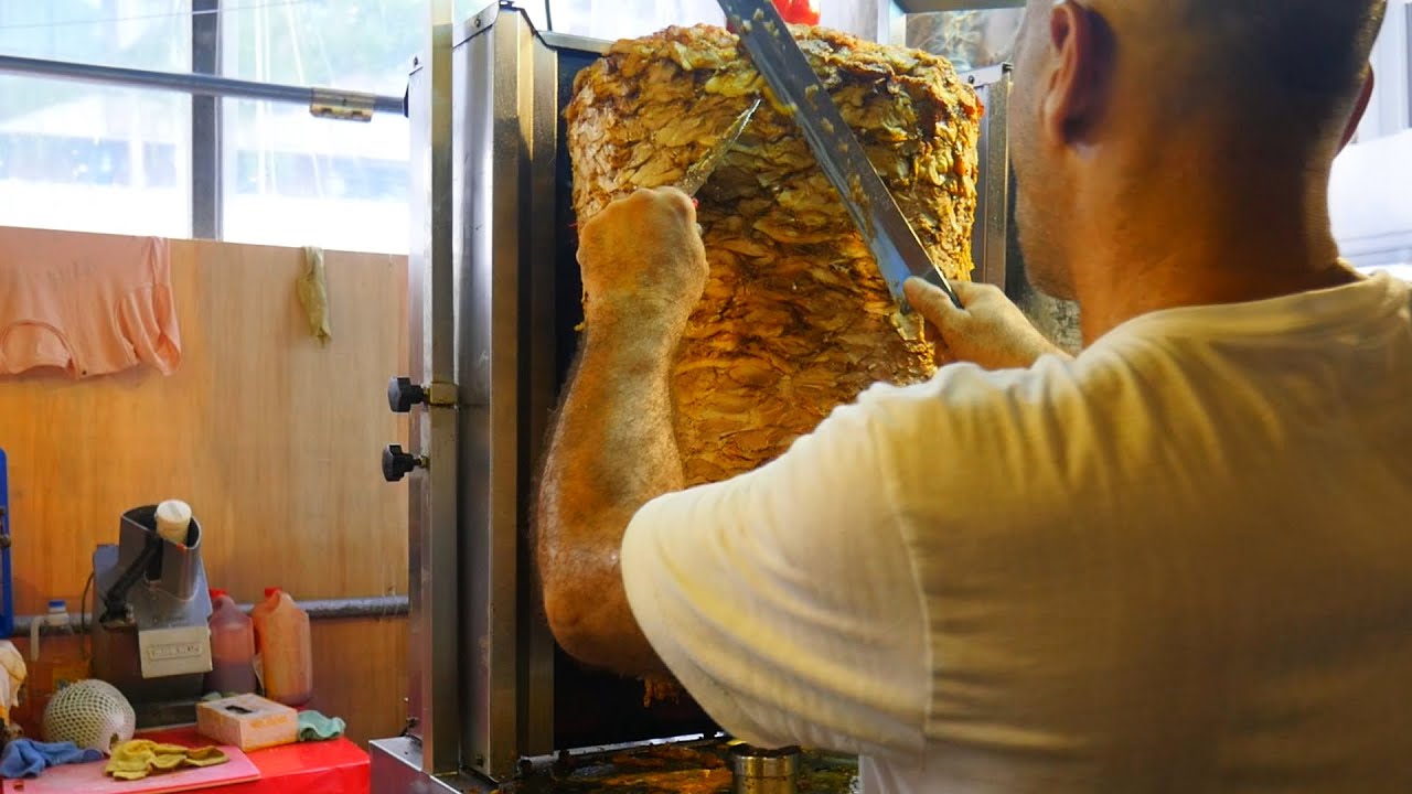 From Grill to Roll! 🍖🥙 Shaved Beef & Chicken Kebab Rolls Drizzled with Savory Condiments 🌶️✨