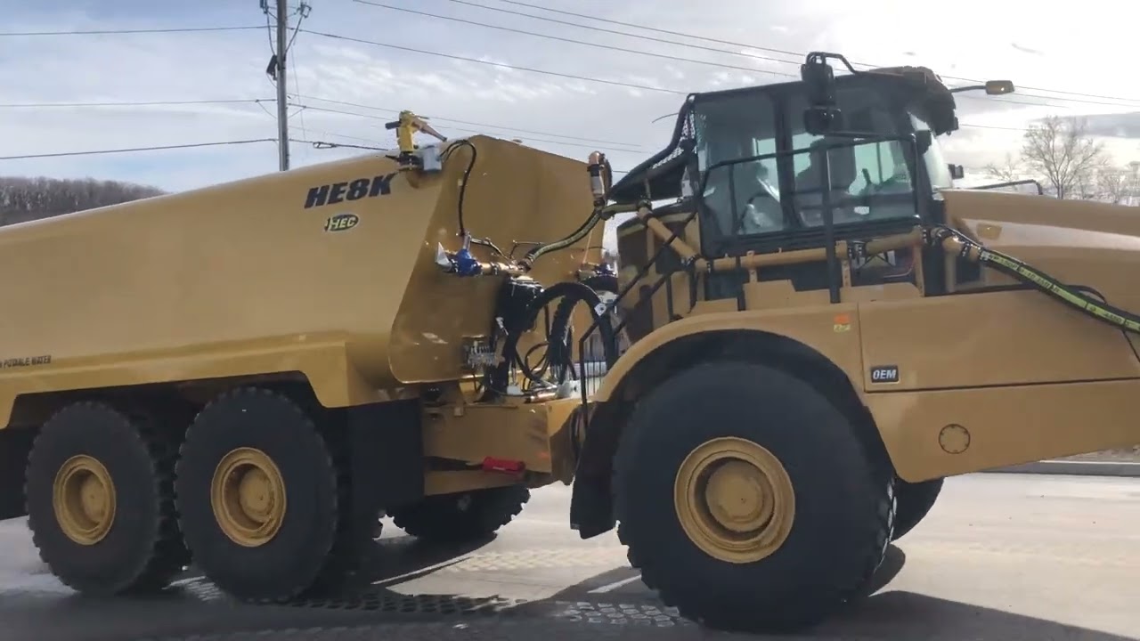 Caterpillar 740GC 40 ton articulated water truck built by HEC with 8,000 gallon tank