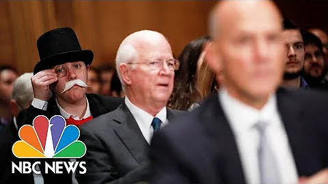 'Monopoly Man' Photobombs Former Equifax CEO Richa...