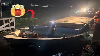 [736] Water hyacinths appear densely at the gate of the dam at night, blocking boats from passing