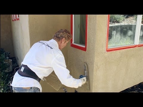 How to apply a stucco skip-trowel finish over a sand finish
