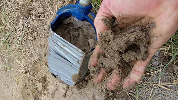 Drilling a water well by hand.