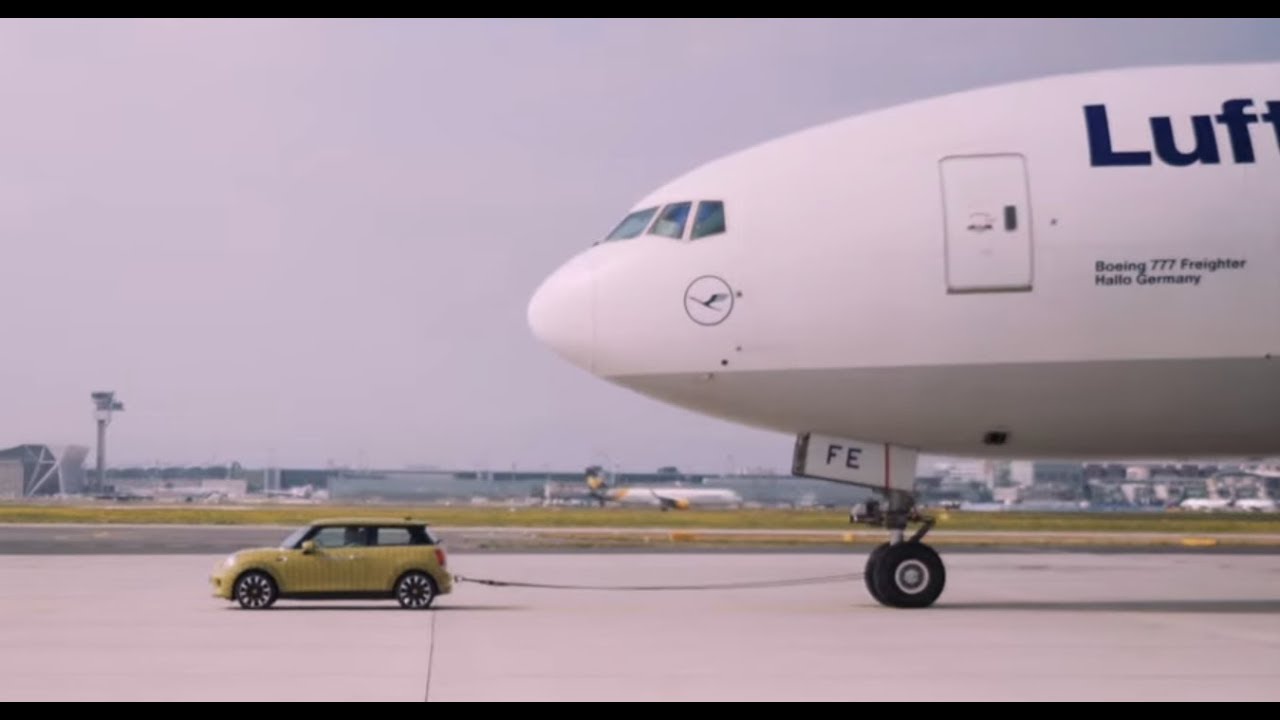 2020 Electric Mini Cooper SE pulls Boeing 777F freight aircraft 