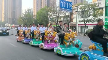 Unusual wedding procession with kiddie rides in Gansu, China