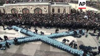 Orthodox faithful in Romania and Bulgaria mark Epiphany with icy plunge