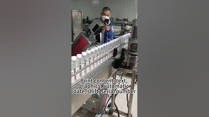 CO2 laser marking machine marking water bottles on the assembly line