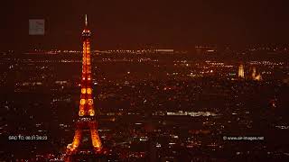 Aerial Footage by night: Paris with the river Seine, the Basilica of Montmartre and the Eiffel tower