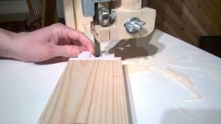 Cutting box joints on homemade bandsaw. These are the second box joints cut on this saw. The paper templates really improved 