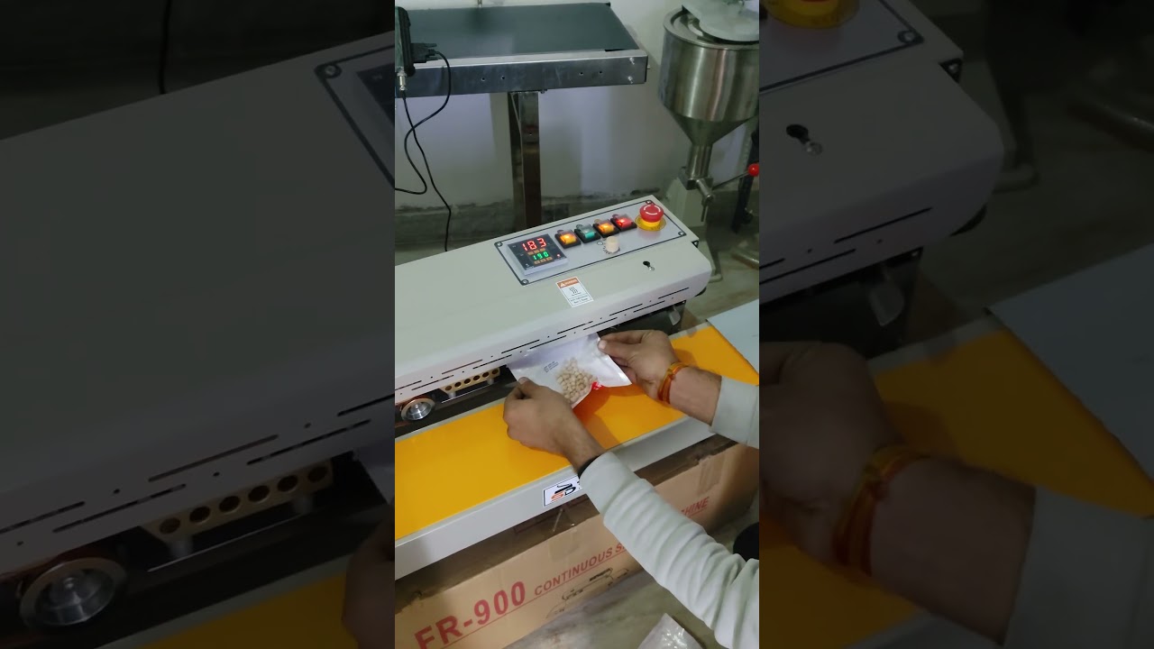 Continuous band sealing machine 