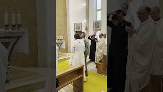Fr Sebastian giving his parents Communion at his First Mass