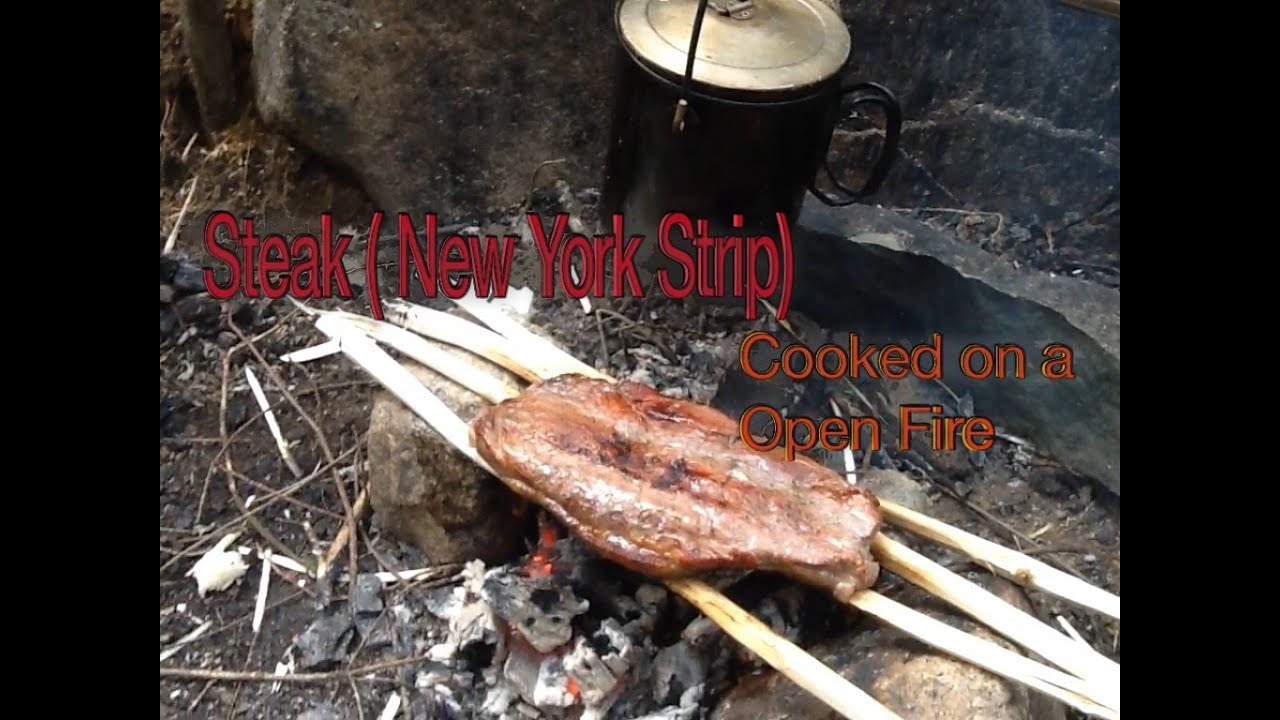 Steak (New York Strip) Cooked on a Open FIRE - YouTube