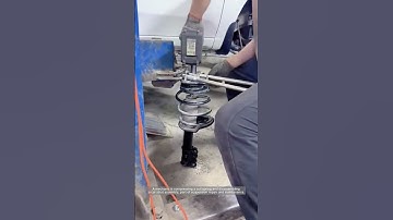 Disassembling a Car Strut: Safe Handling of Coil Springs in Suspension Repair