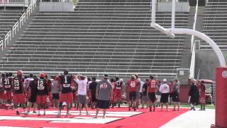 Conner Manning throws a football over the south bleachers of Rice-Eccles Stadium