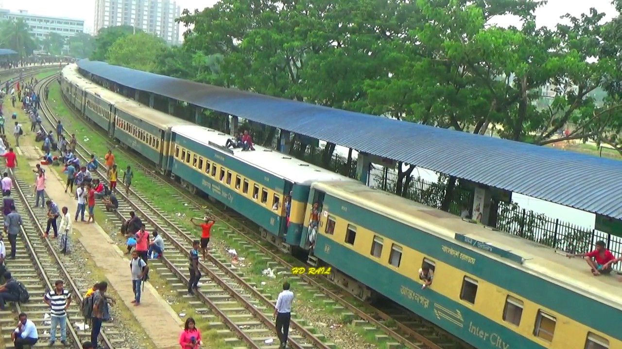 southern railway off peak times Egaro sindur pravati Express train entering Biman Bondor railway station in Bangladesh