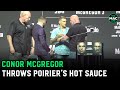 Conor McGregor throws Dustin Poirier's hot sauce off stage at UFC 264 Press Conference