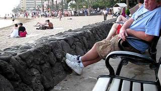 Crazy man on Waikiki Beach talking to himself