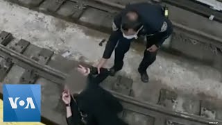 NYPD Rescues Woman From Subway Tracks