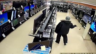 Vandal Smashes TV's in a Store || ViralHog