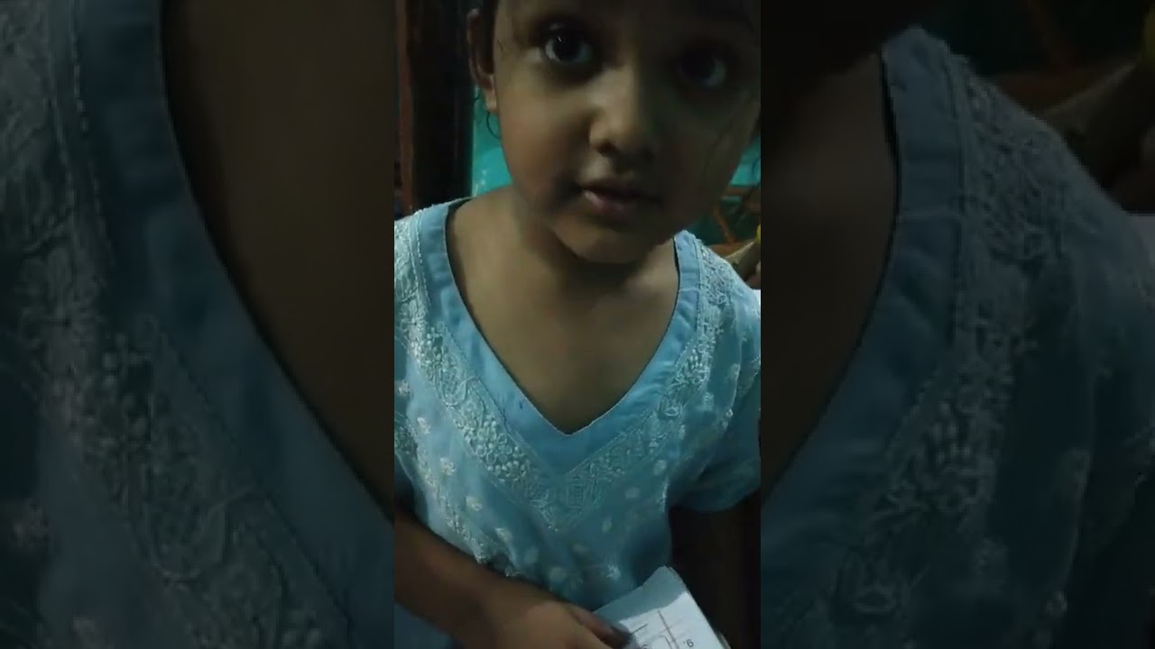 cute little girl reading in sweet manner