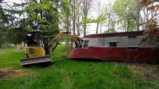 Demolishing Trailer With Excavator