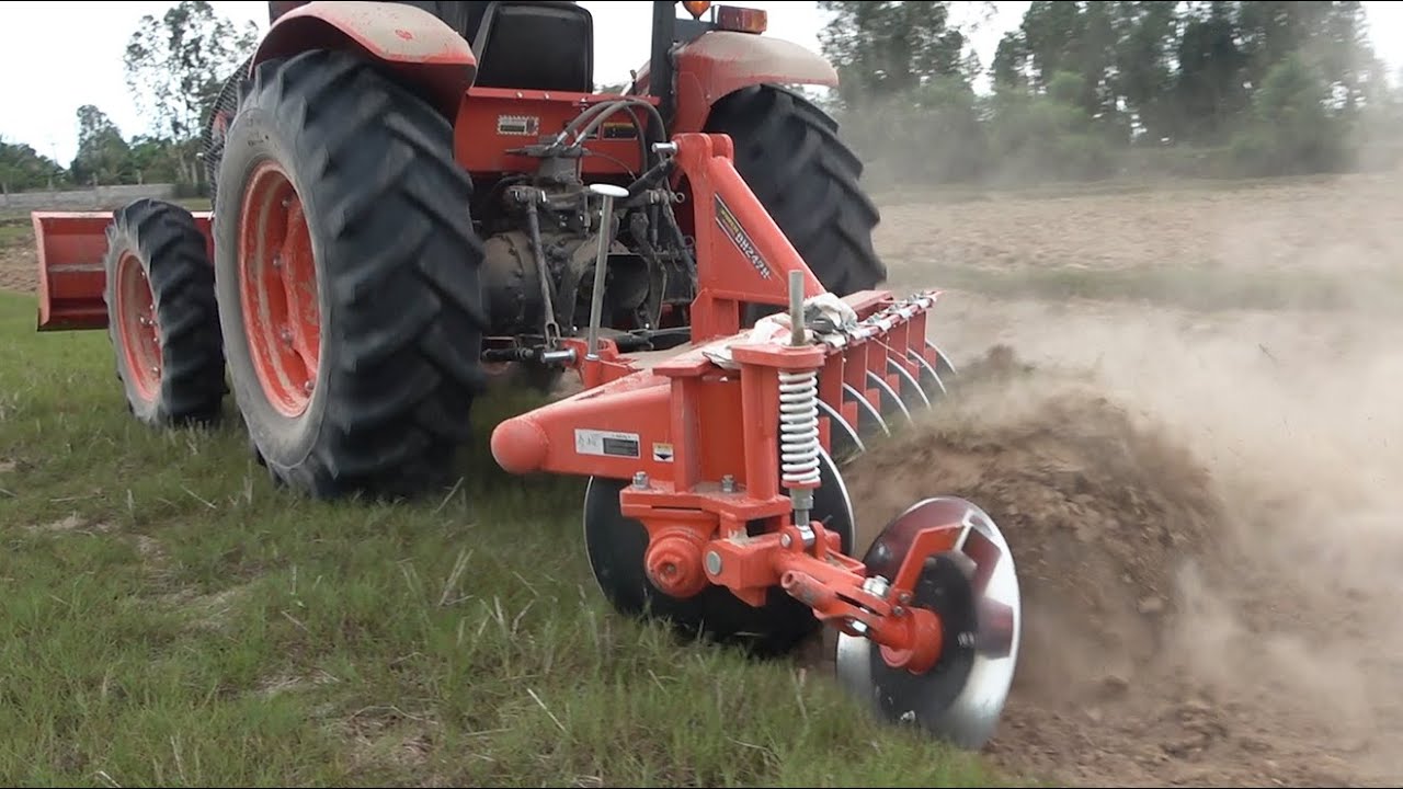New Tractor Kubota M6040su Ploughing on field