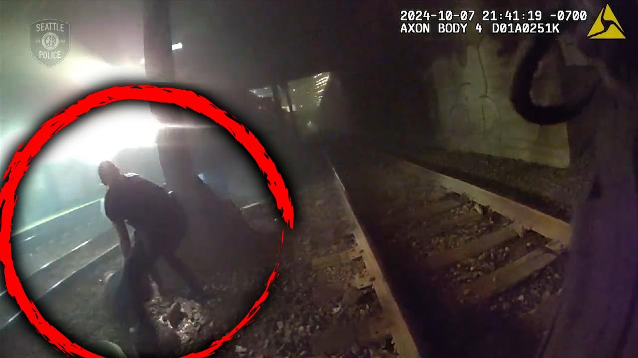 man dragged off track seconds before train