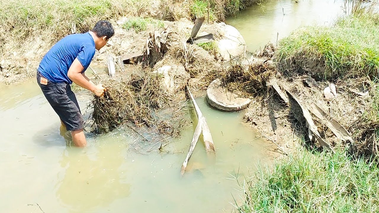 Removing Debris Flow Clogged Culvert Drain - YouTube