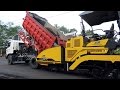 Asphalt Paver Sumitomo HA60C And Dump Truck Working