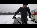 Cleaning off snow in Oakland, MD