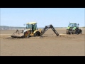 Stuck digger rescued by tractor on Brean beach (From Burnham-On-Sea.com)