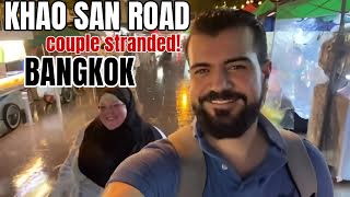 TOURIST COUPLE GET STRANDED IN A FLOOD ON KHAO SAN ROAD BANGKOK THAILAND