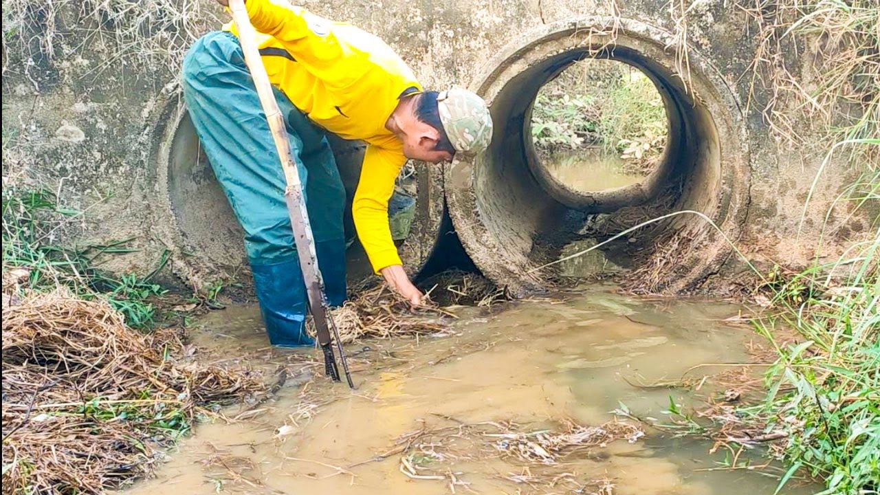 Removing Debris Flow And Trash Clogged Culvert Drain Water To Farm In ...