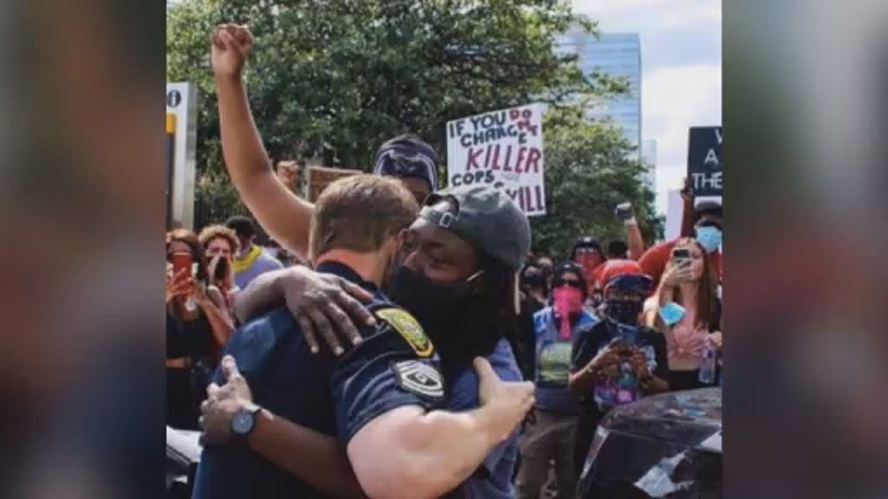 Touching moment between HPD officer and protester