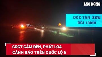 CSGT cắm đèn, phát loa cảnh báo trên Quốc lộ 6 | Báo Lao Động