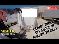 Clamp Truck Stranded In Fallen Trailer