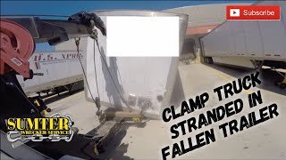 Clamp Truck Stranded In Fallen Trailer