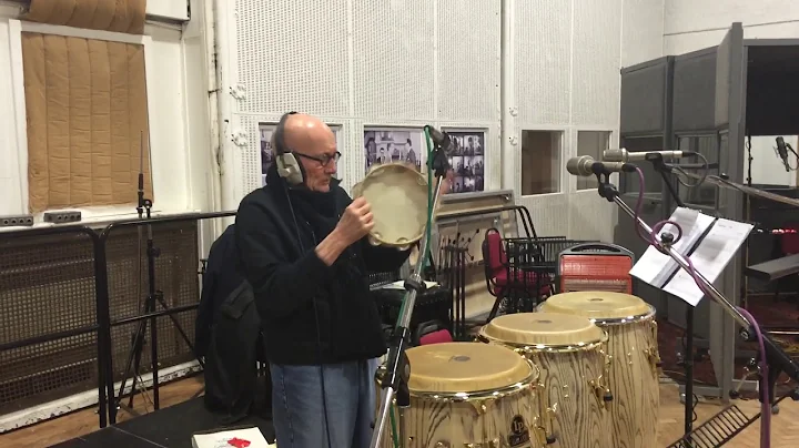 Ray Cooper plays the tambourine.