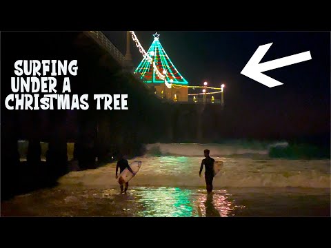 Night Surfing under a lit Christmas Tree