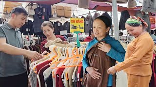 NHAT and her husband bought new clothes for both mothers, which made them very happy.