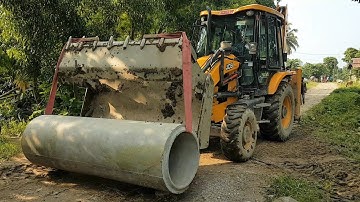 JCB Dozer Lifting Heavy Culvert Pipe and Installing in Drain - JCB Video