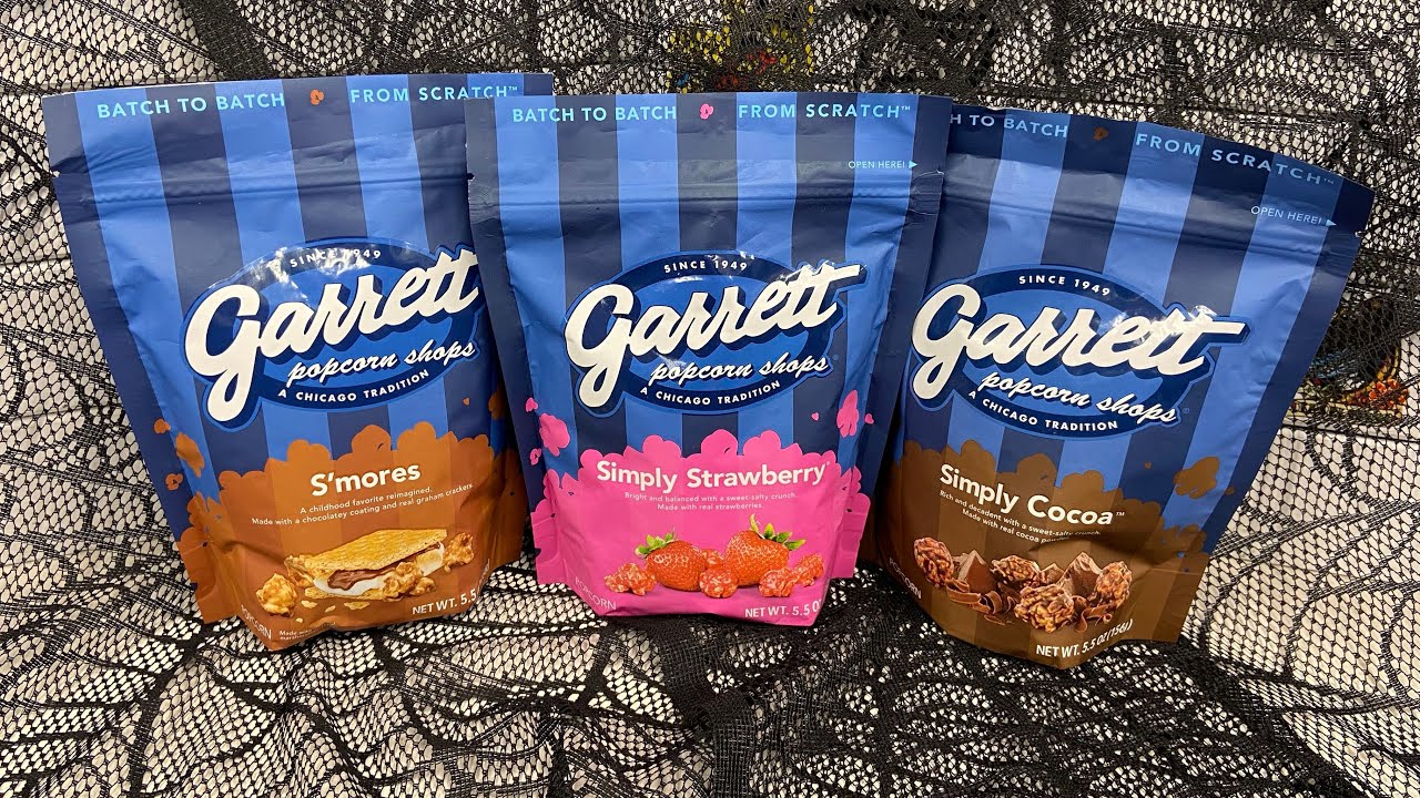 3 flavors of Garrett Popcorn! S’mores, Cocoa & Strawberry. Hella good 