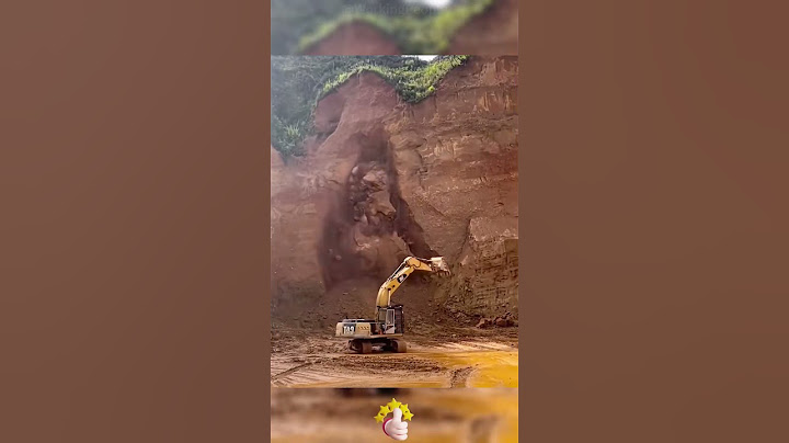 The process of an excavator digging into the mountain.