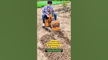 A Remote-Controlled Mini Excavator in Action: Tiny Machine, Big Power